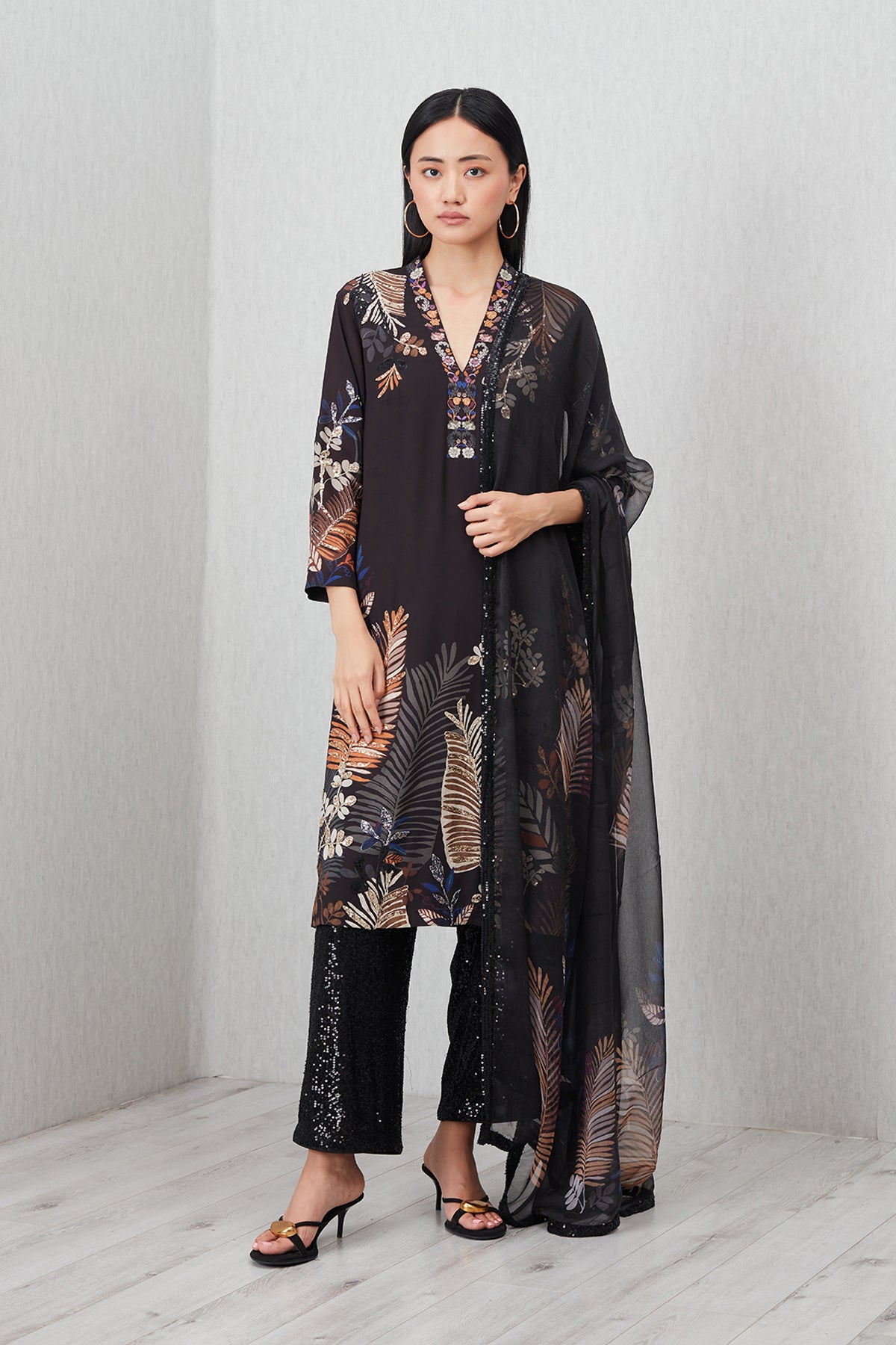 Ranna Gill black embroidered tunic set with floral motifs, paired with sequin trousers and matching dupatta.