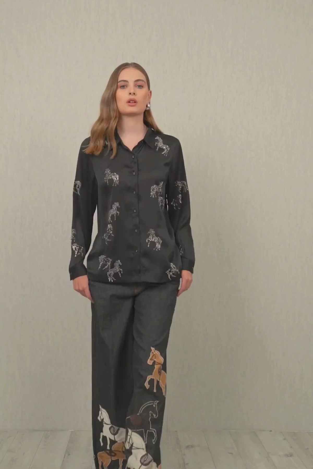 Ranna Gill Lyla Buttondown Shirt in black crinkle chiffon with crystal-studded horse embroidery, full sleeves, collared neckline, and front button closure.
